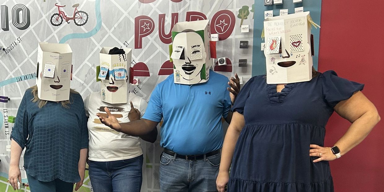 Group of people wearing boxes