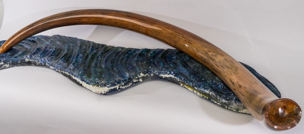 Mammoth Tusk ( 60 " )  on cast glass base duplicating permafrost melt.  Est 10,000 years old, Cast G