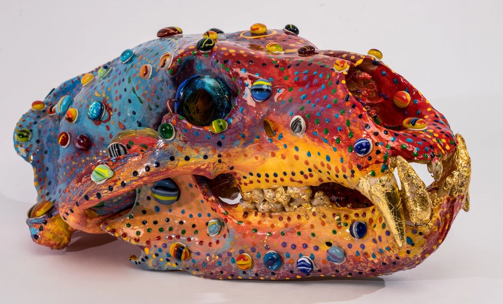 Skull art, made from Bone ( Polar Bear) , epoxy, Paints, Gold Leaf, Glass beads all individually mad