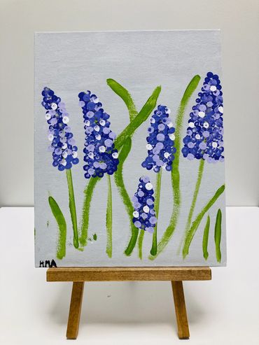 A painting of lilacs.