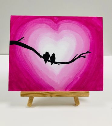 A painting of birds against a pink heart shaped background.