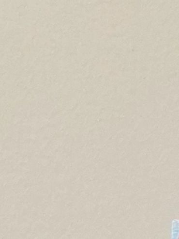 A painting of a tree with pink, red and white flowers.