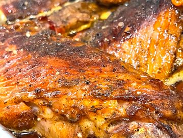 Deliciously tender and flavorful smothered Turkey wings are served with two sides.