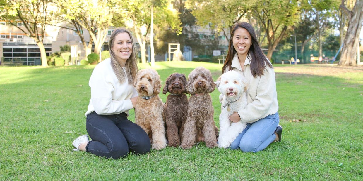 Lyndsey and Chloe with labradoodles Teddy, Max, Bailey and Winnie