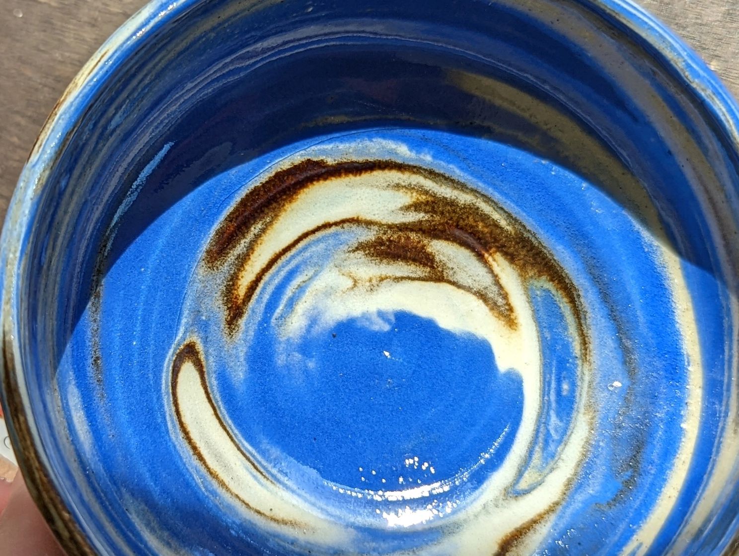 blue, cream, and brown swirled bowl