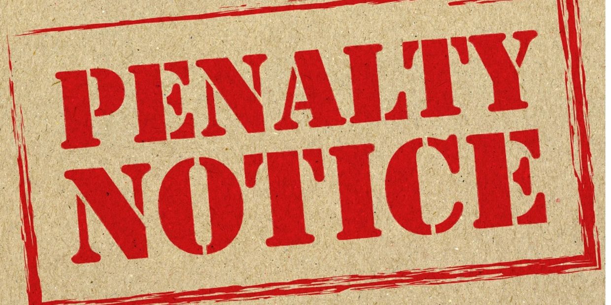 A stamped text saying 'PENALTY NOTICE' in red on a cardboard background.