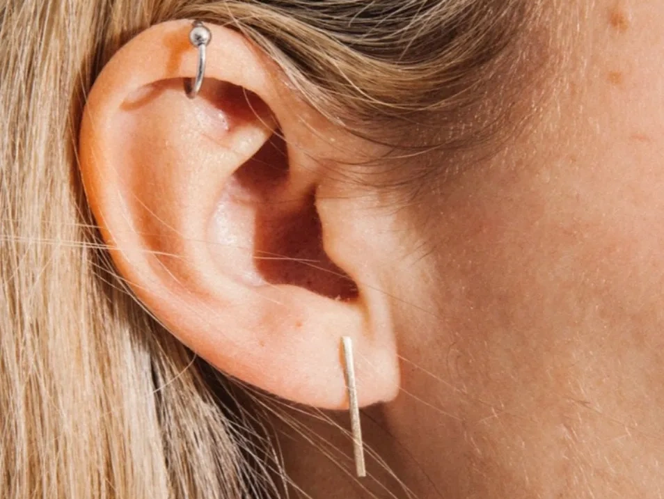 Close up image of An ear piercing