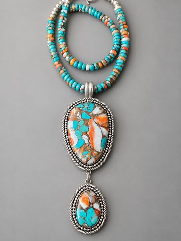 Handcrafted sterling silver statement necklace featuring turquoise and spiny oyster shell composite