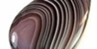 Close-up of a polished banded stone.