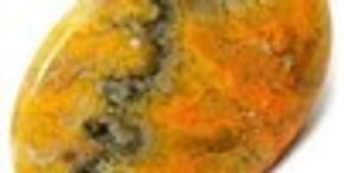 Polished jasper stone with orange and gray patterns.