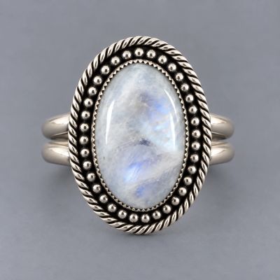 Handcrafted sterling silver ring with oval moonstone cabochon, silver bead accents and twisted wire