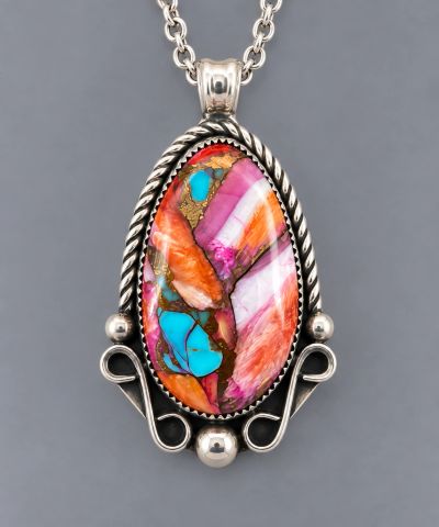 Handcrafted sterling silver pendant with colorful spiny oyster and turquoise cabochon, twisted wire