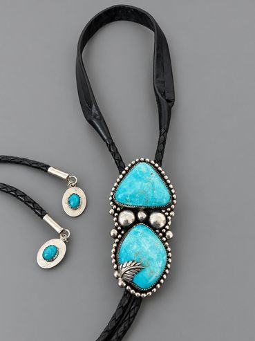 Two-stone turquoise sterling silver bolo with black braided leather