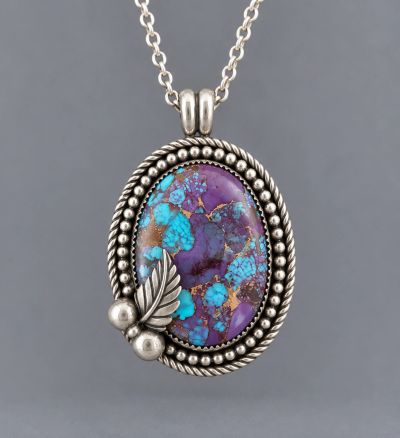Purple Mohave turquoise composite pendant handcrafted in sterling silver with decorative leaf and si