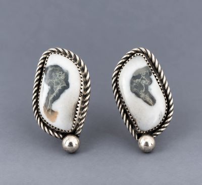 Pair of oval moss agate post earrings with twisted sterling silver borders and silver bead accents.