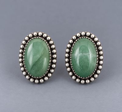 Pair of oval green aventurine post earrings in handcrafted sterling silver with beaded borders.