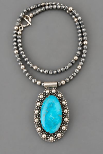 Kingman turquoise sterling silver pendant on a single strand of sterling silver beads, handcrafted b