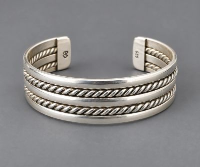 Handcrafted sterling silver cuff with two twisted rope details and smooth silver bands