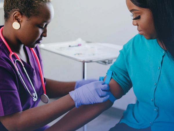 "Mobile phlebotomist performing at-home blood draw service"