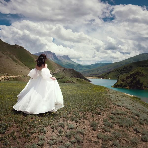bride on mountain by a lake