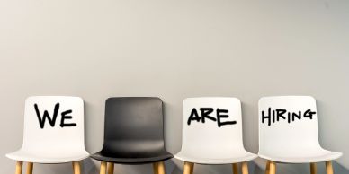 Chairs with 'We Are Hiring' signs.