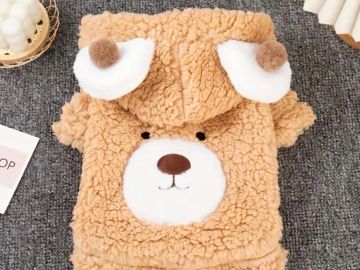 Soft, fluffy bear-themed blanket with cute face and ears.