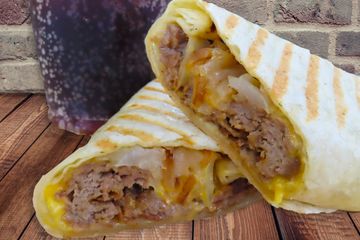 cheesesteak wrap filled with philly beef steak cheddar cheese and onions