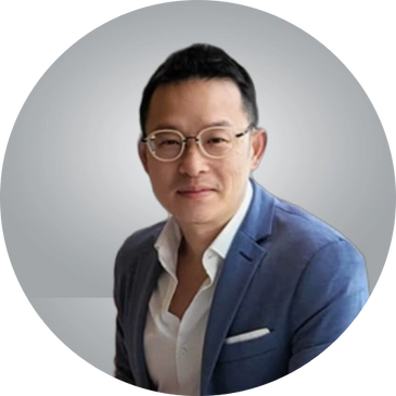 Professional man wearing glasses and a blue blazer.