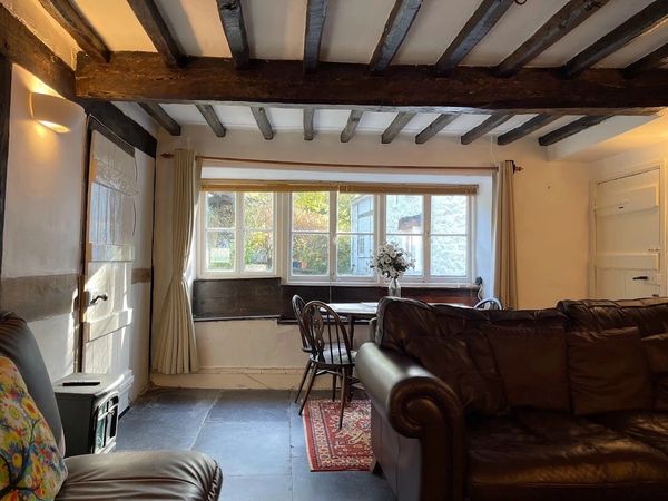 The dining room and sitting room at the Farmhouse, Family Holiday cottages mid wales