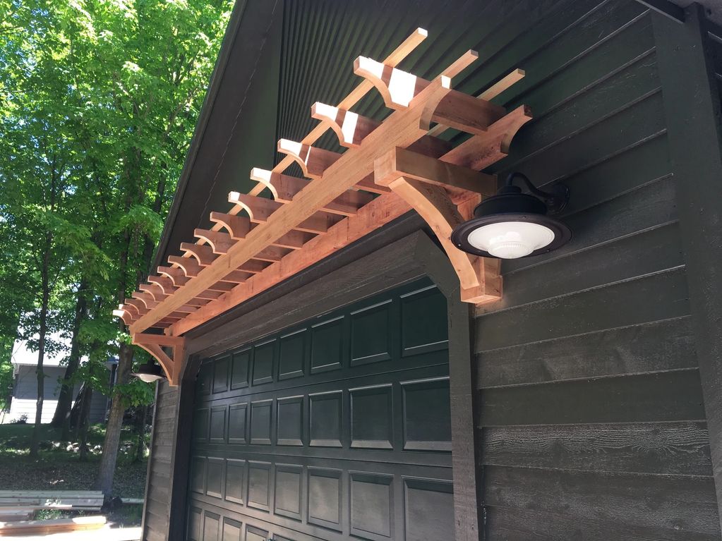 Cedar pergola over a customer's garage door.