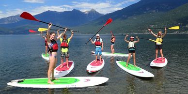 Group paddle board lessons on with Kaslo Kayaking
