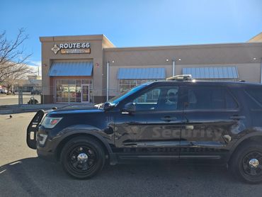 Black security SUV parked outside Route 66 Children's Dentistry.