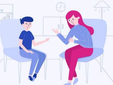 A woman and a boy having a conversation while seated.