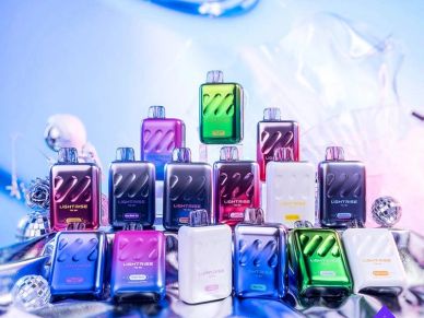 Colorful vape devices stacked in a pyramid arrangement with a blurred background.