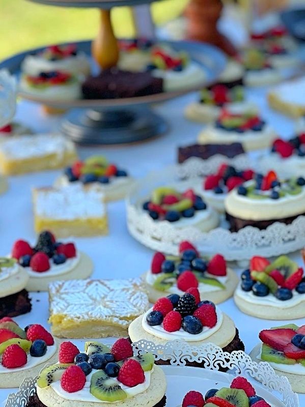 Dessert Table featuring mini fruit tarts, and assorted bars