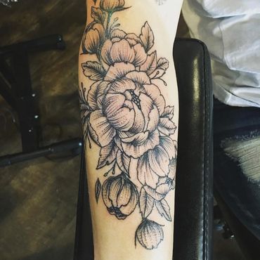 Minimalist Peony tattoo by Wojo.
