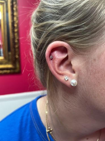 Cartilage piercing on a client by Jean.