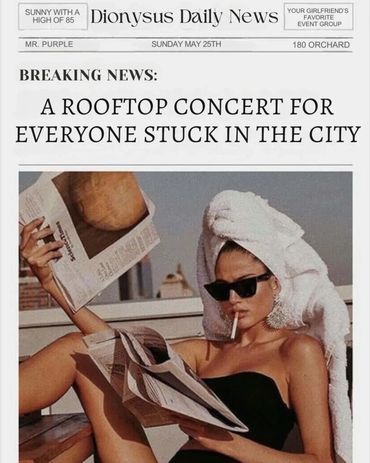 Woman in sunglasses reading newspaper on rooftop, relaxing with towel on head.