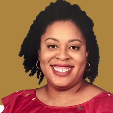 Owner Kara Cashwell, a black woman with a bright smile. Curly hair pinned back from her face