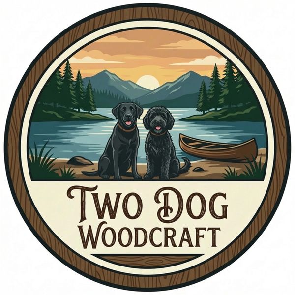 Logo of two dogs by a lake with mountains and a canoe.