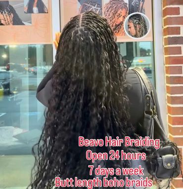 Woman with long, intricate boho braids at Beavo Hair Braiding, open 24/7.