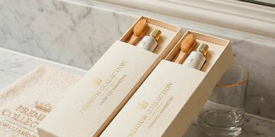 Elegant premium collection dental kits on a marble bathroom counter.