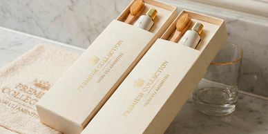 Elegant premium collection dental kits on a marble bathroom counter.