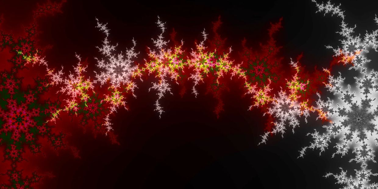 Colorful fractal pattern with red, white, and green star-like shapes against a dark background.