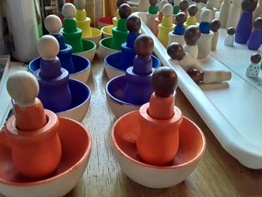 Montessori and Waldorf-inspired hand-painted wooden peg dolls and toys