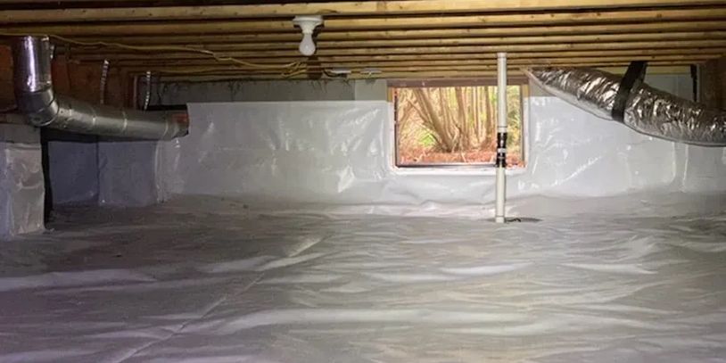 Clean, moisture-proof basement crawl space with plastic lining and ventilation.