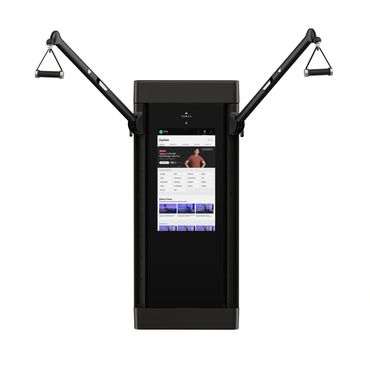 Modern black home gym system with touchscreen and adjustable arms.