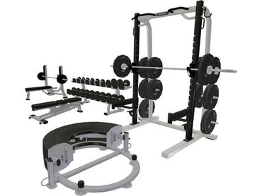 A set of modern gym equipment including weights and benches.
