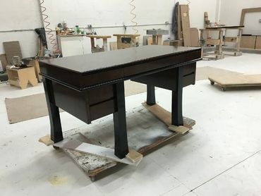 A dark wood table in a room