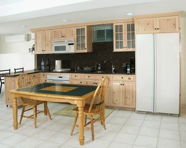 Item: KTC015 - Knotty Pine, Granite, Acid Etched glass Traditional style with raised panels.